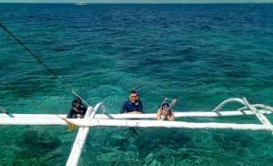 Guests enjoying the blue water from our boat