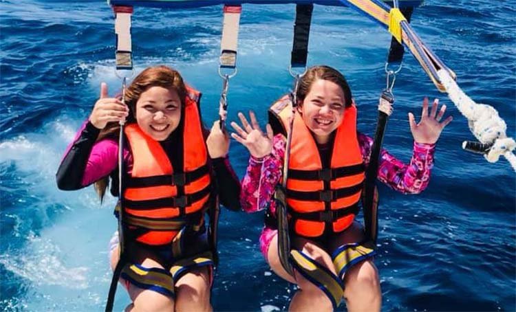 Two Girls Enjoying Parasailing in Mactan